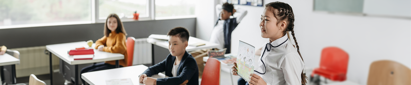 Children in a well lit classroom