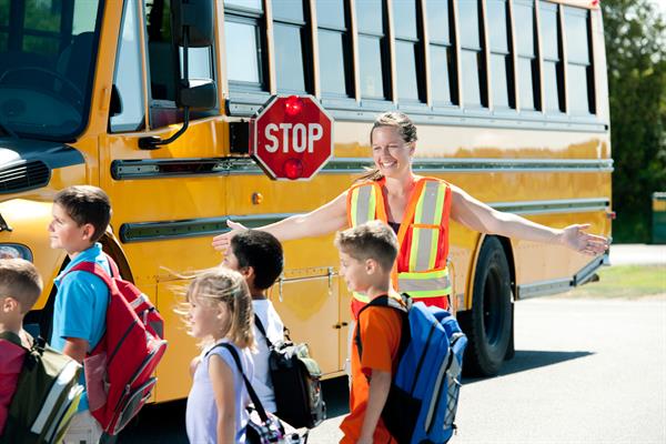 Students crossing at a bus crosswalk