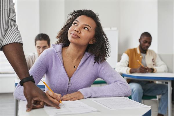 A student talking a test in the classroom