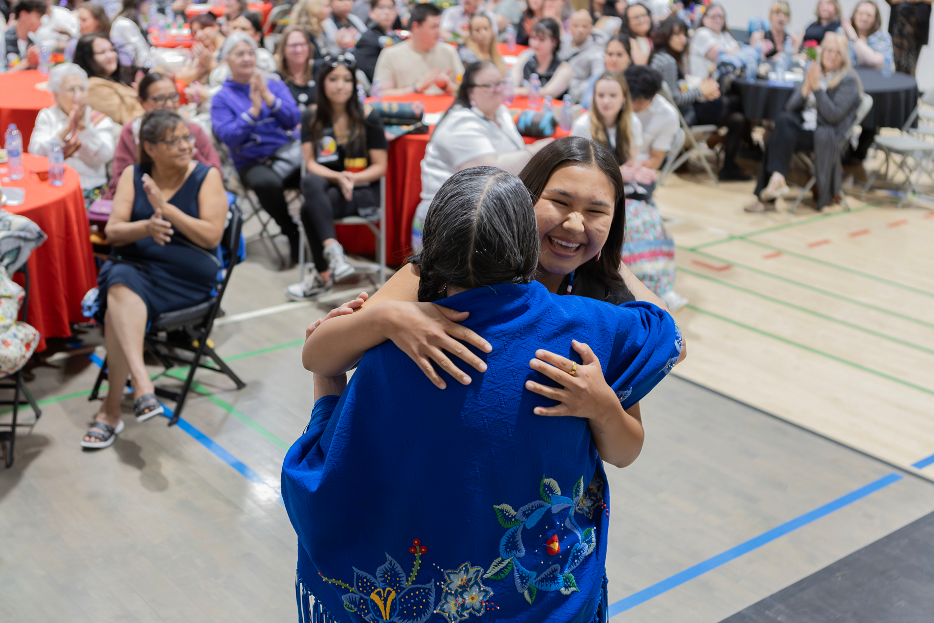 Student Hugging Elder