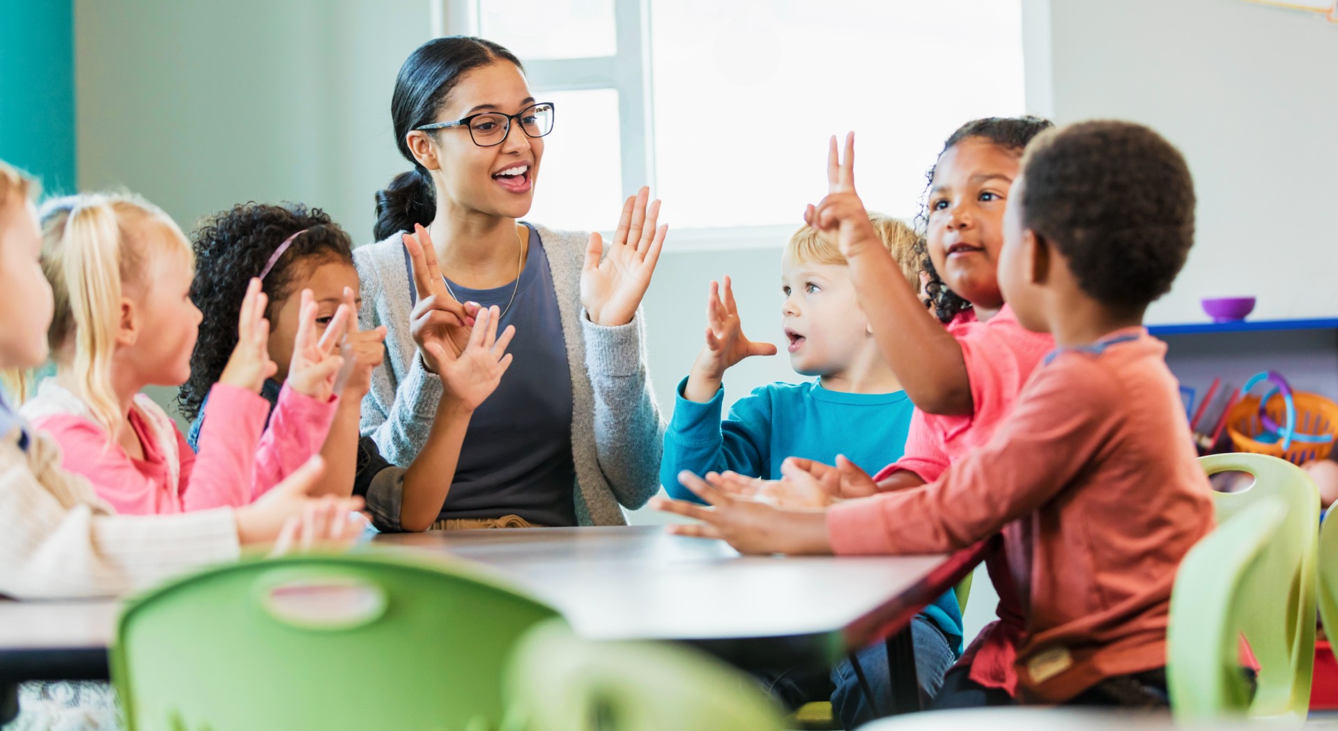Teacher sitting with student